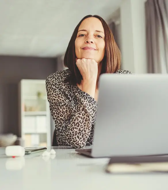 Woman at desk with laptop