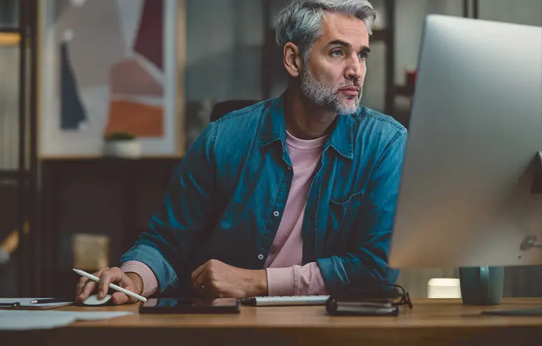  Man working at desktop computer